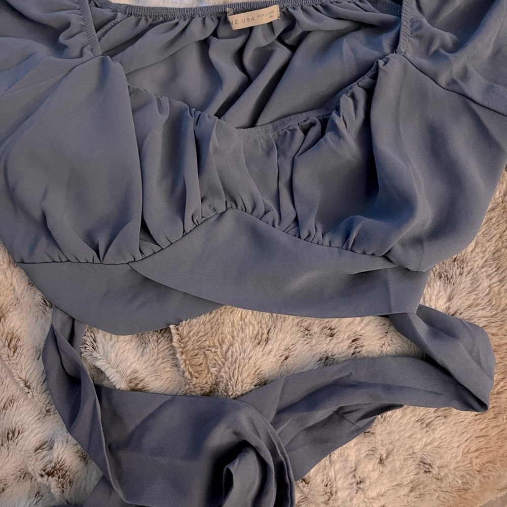 A light blue long sleeve crop top